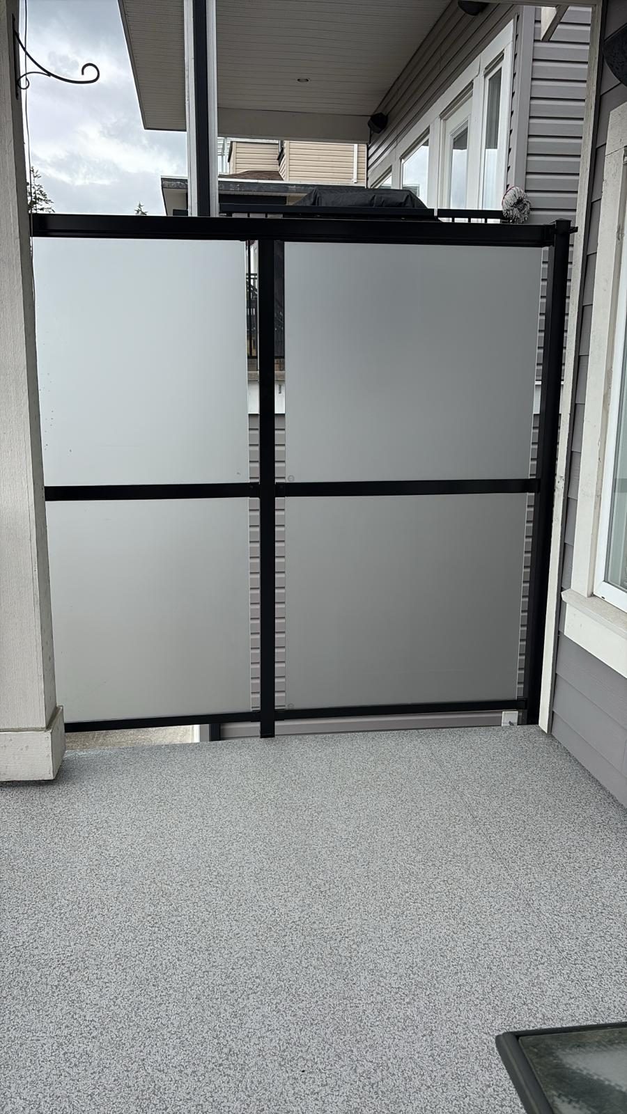 Frosted glass privacy panels on a deck in Coquitlam