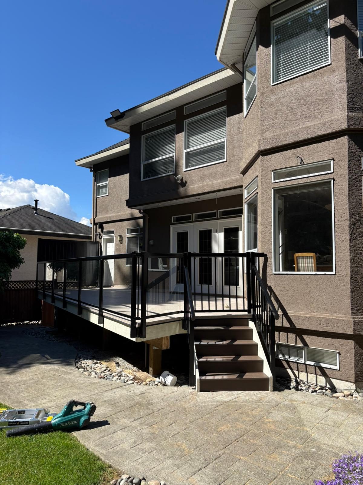 Black aluminum deck and stair railing on a Coquitlam home