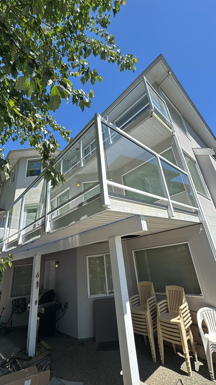 Glass balcony railings on a Port Moody house