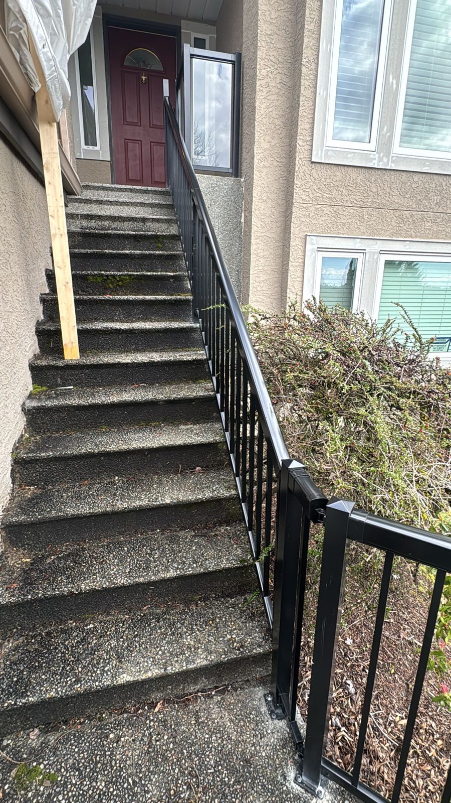 Aluminum stair railing on front steps in Ladner