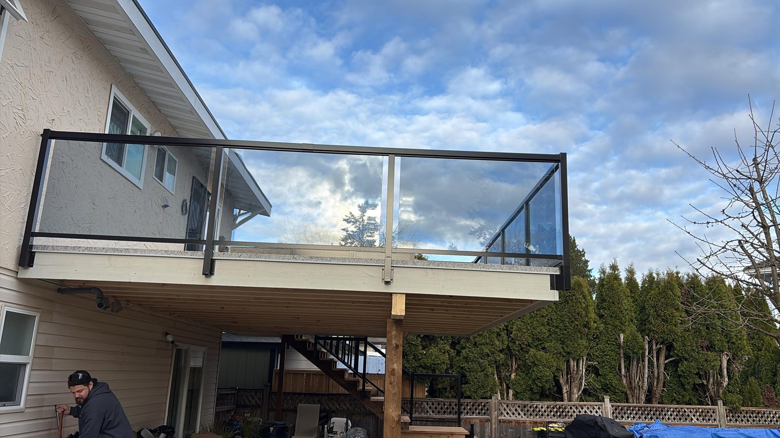 Black aluminum glass railing on a raised deck in Brookswood, Langley