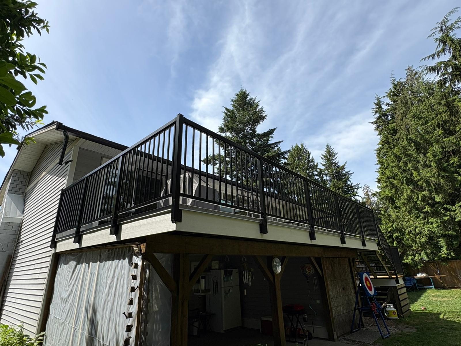 Black aluminum picket railing on a second-storey deck in Langley
