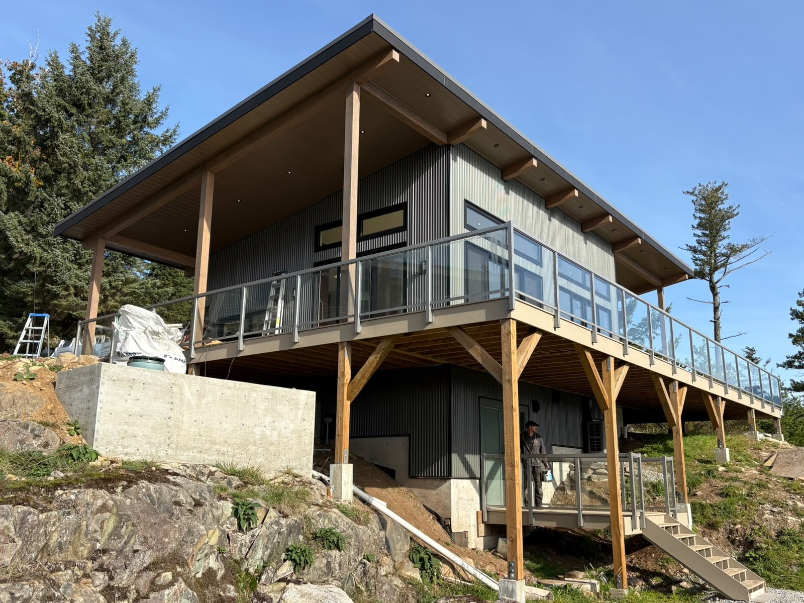 New hillside home on Gambier Island with deck railings