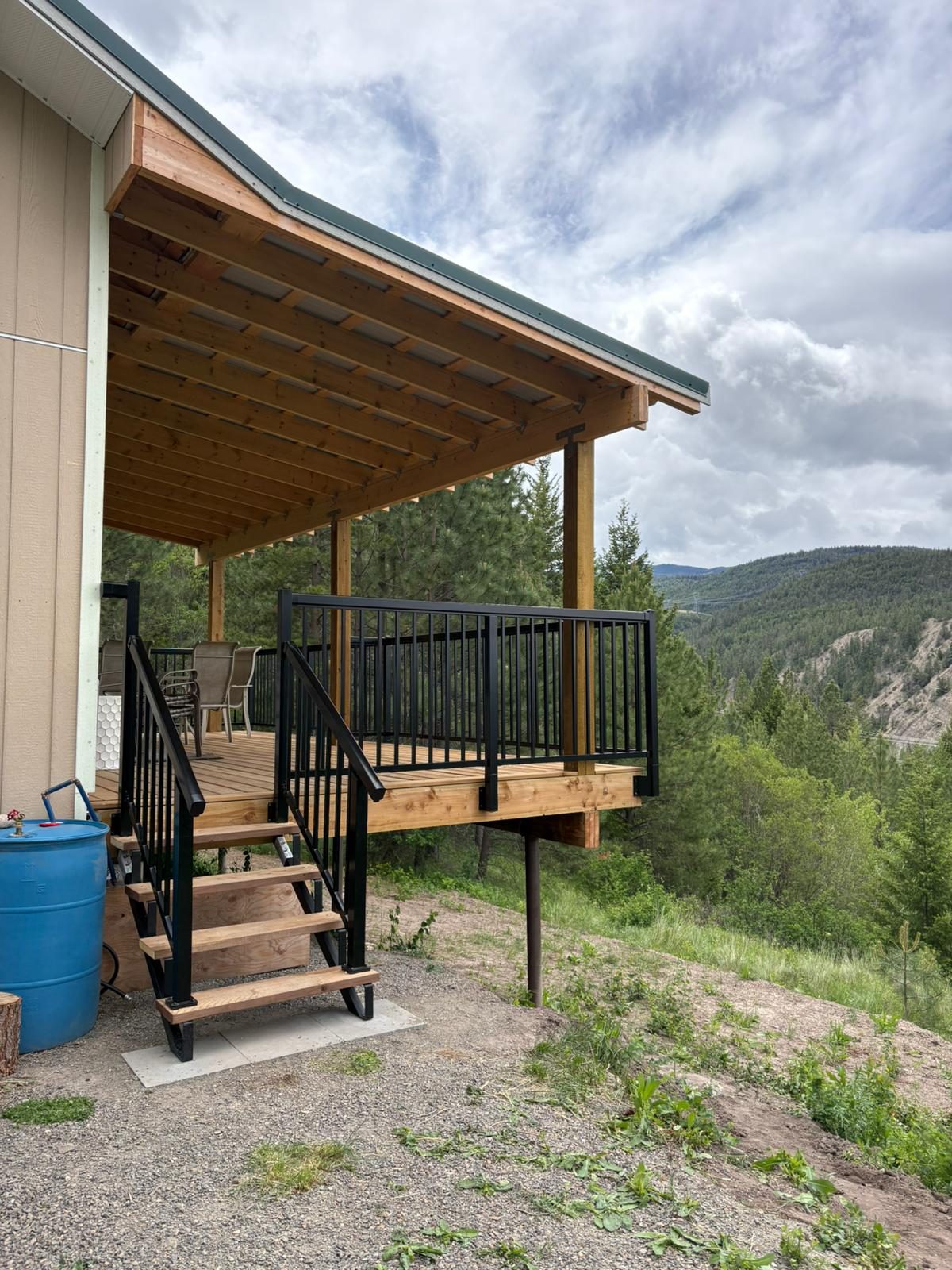 Black aluminum deck and stair railing on a Merritt home